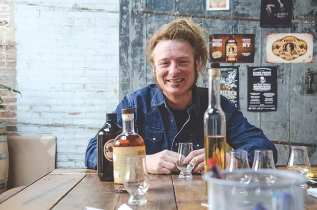 Rocker Tommy Brunett is co-owner of Fairport's Iron Smoke Whiskey. - PHOTO BY MARK CHAMBERLIN