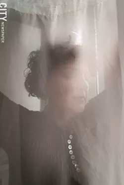 Rebecca Lomuto, veiled. - PHOTO BY RYAN WILLIAMSON