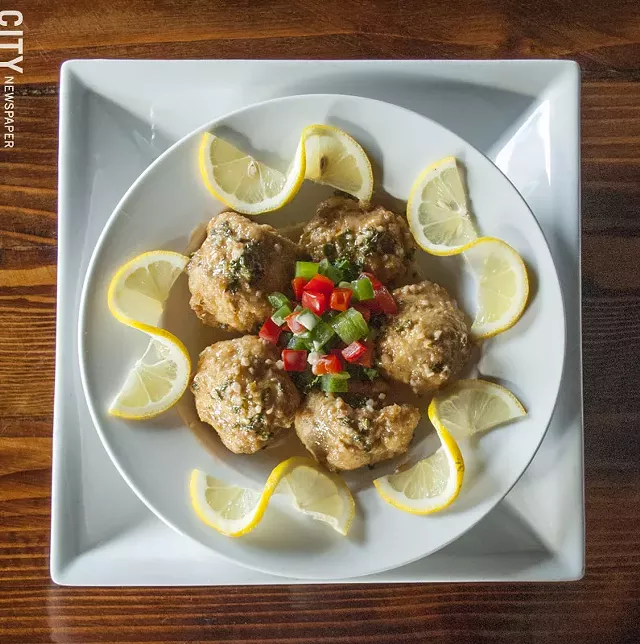 The Pan Roasted Artichoke Hearts are lightly battered and roasted, served with a garlic lemon-sherry creme. - PHOTO BY RENÉE HEININGER