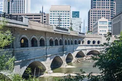 The city plans to remove the upper portion of the Broad Street bridge – the roadway and the row of arches below it – and take the bridge back to the elevation of the original Erie Canal. The bottom set of arches are the canal's original set. - FILE PHOTO