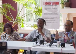 Christopher Pate (center) with his mother and Rev. Lewis Stewart. - PHOTO BY RENEE HEININGER