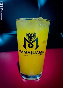 Fresh mango juice from MamaJuana's juice bar. - PHOTO BY RYAN WILLIAMSON