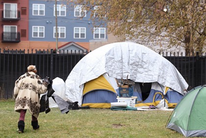 City moves to clear homeless camp as fencing is built