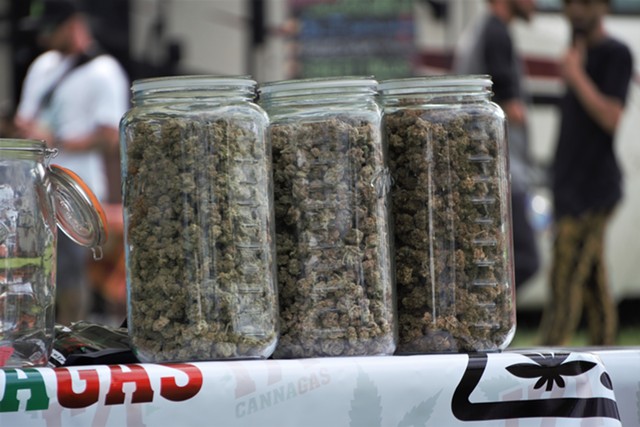 Jars of bud at Canna Gas's booth at the Cannabis Carnival.