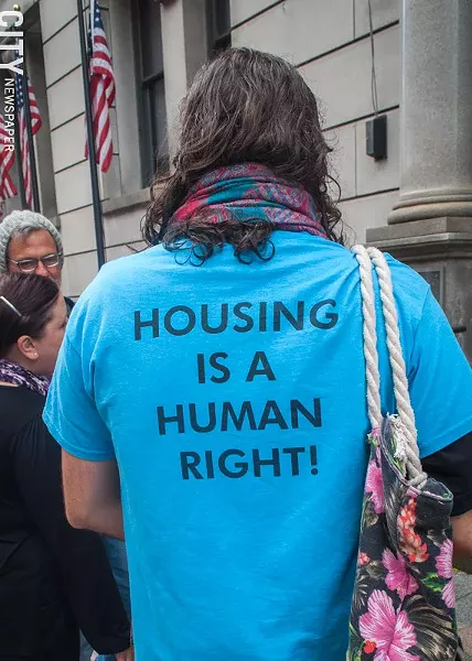 Housing activist Ryan Acuff outside of the Monroe County Office Building prior to a state Assembly hearing on rental housing and tenant protections. - PHOTO BY RYAN WILLIAMSON