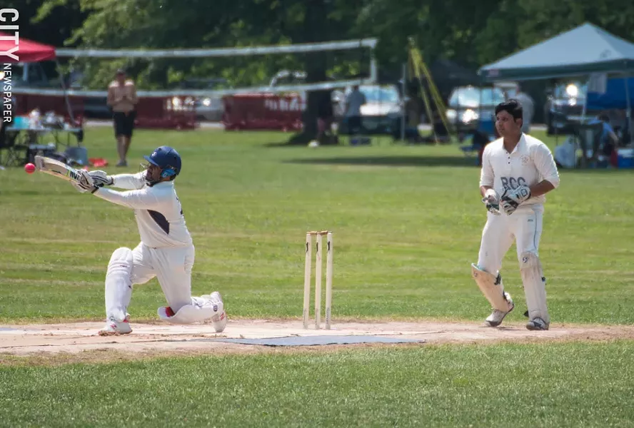 A Buffalo player hits the ball as keeper Ramakant Desani watches. - PHOTO BY JACOB WALSH