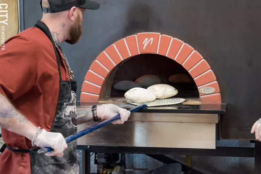 The bread is made with a 100-year-old Neapolitan recipe, with a high-gluten flour and brick-oven baked. - PHOTO BY JACOB WALSH