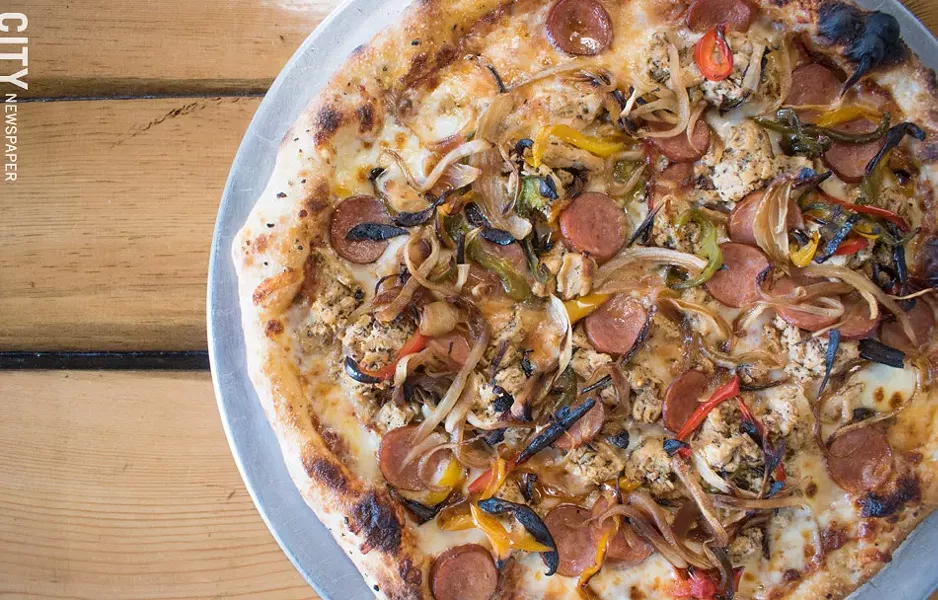 There's a menu of wood-fired, 12-inch pizzas, most of which include spiedies as toppings, though anything on the menu is available in a vegetarian version. Pictured: the Plain Jane pizza. - PHOTO BY JACOB WALSH