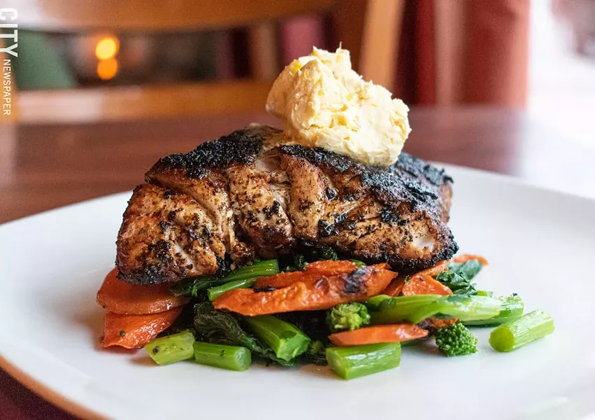 Blackened red snapper with yellow pepper butter, carrots, and sauteed broccoli rabe. - PHOTO BY JACOB WALSH
