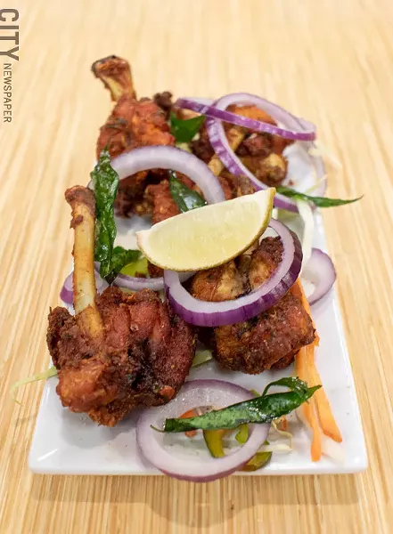 The hilariously titled "chicken lollipops" are just chicken wings marinated with spices, battered, and deep fried. - PHOTO BY JACOB WALSH