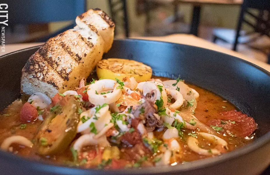 Not your usual flash-fried squid: the Calamari di Roma is sautéed with cherry peppers, onions, garlic, and tomato sauce. - PHOTO BY JACOB WALSH