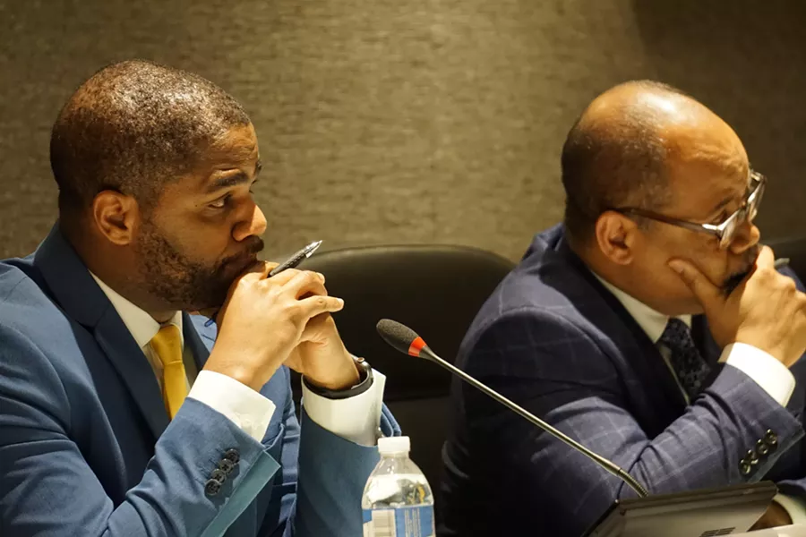 Superintendent Terry Dade and school board President Van White listen to speakers during a board meeting. - FILE PHOTO