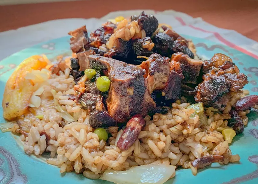 Jerk oxtail, rice and beans, and sweet plantains at Pan-Cart on East Main Street. - FILE PHOTO