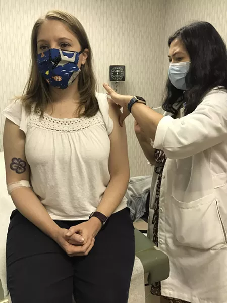 Becky Timmons gets her first dose of a potential vaccine for the novel coronavirus at Rochester General Hospital on Thursday. - PHOTO PROVIDED BY ROCHESTER REGIONAL HEALTH