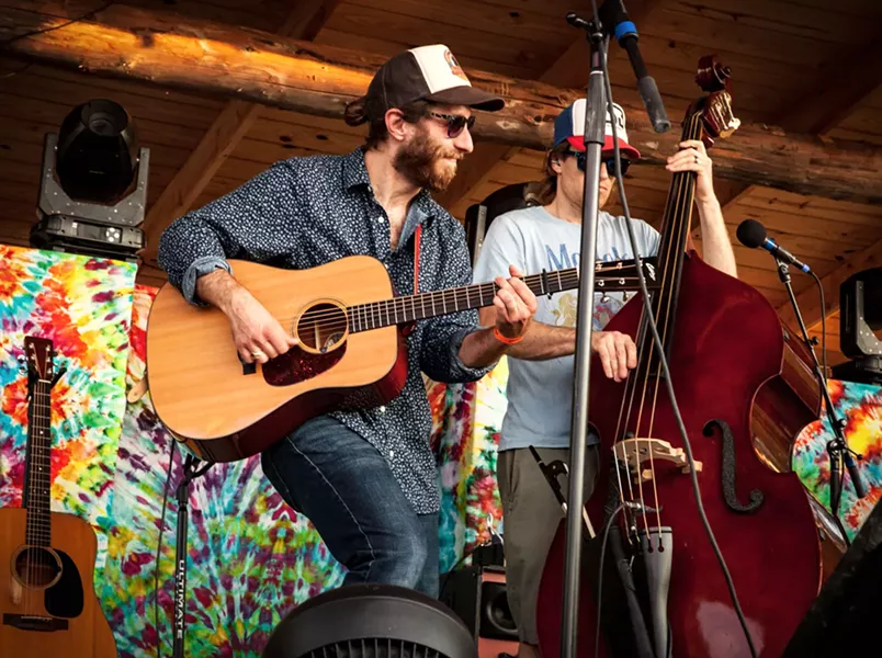Max Flansburg (left) performing with Dirty Blanket at Lincoln Hill Farms on July 3. - PHOTO BY TOM FUCILLO
