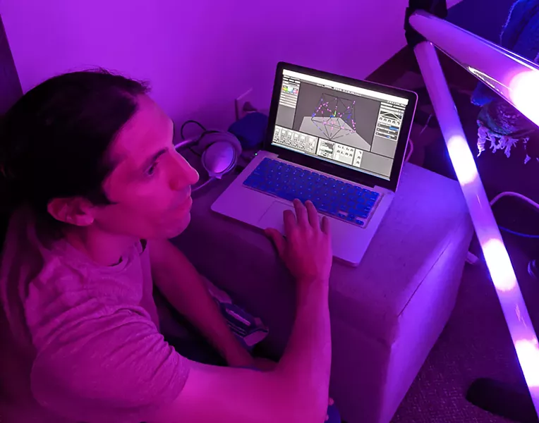 Tom Montagliano demonstrates the software he created with Tracy Scott for BLOOM's light design. - PHOTO BY DANIEL J. KUSHNER