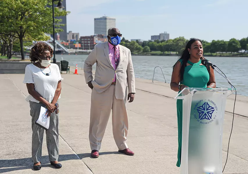 Mayor Lovely Warren, right, stands with Commissioner of Environmental Services Norman Jones and City Council President Loretta Scott to announce the start of a project to rebuild a section of the west wall of the Genesee River. - PHOTO BY JEREMY MOULE