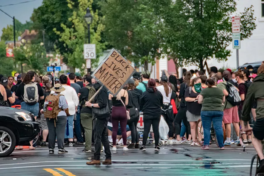 Protesters gathered at the intersection of Jefferson Avenue and Dr. Samuel McCree Way. - PHOTO BY JACOB WALSH