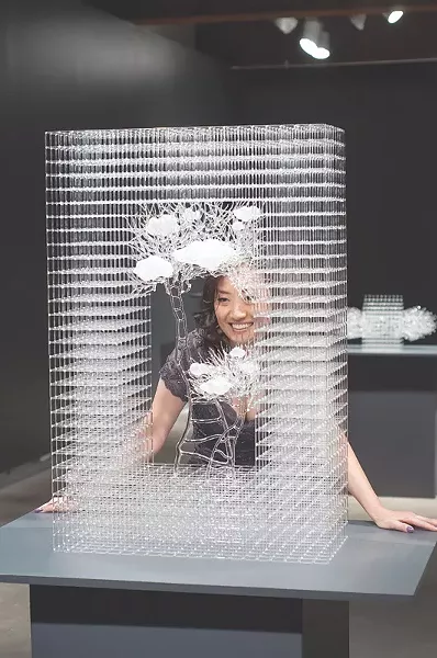 Eunsuh Choi with one of her intricate glass sculptures. - PHOTO PROVIDED
