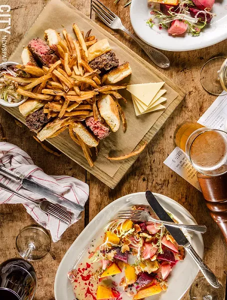 The Good Luck Burger at Good Luck Restaurant in Rochester acoompanied by a roasted beet salad. - PHOTO BY MARK CHAMBERLIN