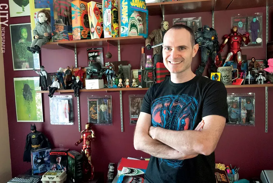 Ben Scrivens stands in front of his collection of movie memorabilia. - PHOTO BY RYAN WILLIAMSON
