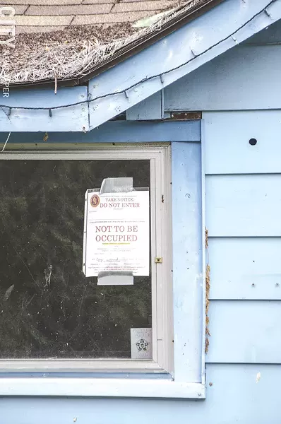 This zombie house in Irondequoit will be demolished. - PHOTO BY MARK CHAMBERLIN