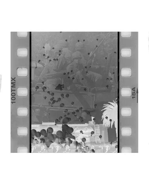 "Globos" depicts the Abuelas de Plaza de Mayo protesting their sons' disappearances by releasing white balloons into the sky. - The exact number of balloons released corresponded to the number of disappearances. In the background is a image of the military junta in the street during the Dirty War.