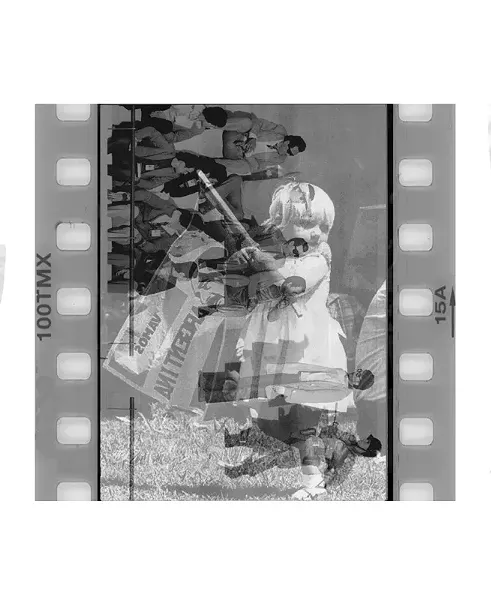 "Vamos Argentina" is an image taken of a student being arrested by the right wing military force during the world cup in 1978. This image was originally titled (translated) "While the World Watched". The image is over laid with a little girl at a protest with a flag that says "Vamos (we can do it) Argentina!"