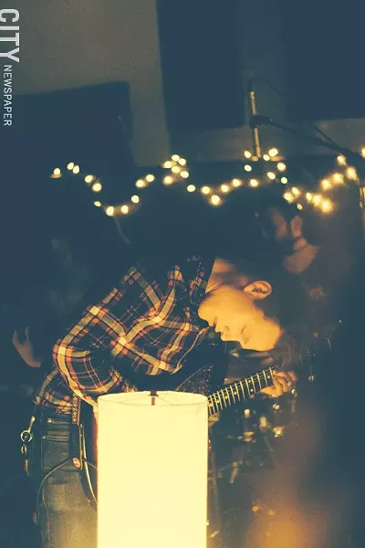 Oh Manitou guitarist Sean Greif during a small show at Wicked Squid Studios. - PHOTO BY KEVIN FULLER