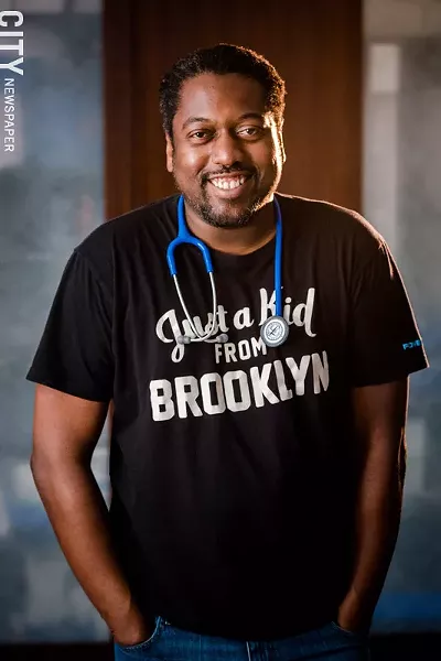 Dr. Ian Wilson is known in the arts crowd as the founder of Rochester's annual muralism festival, WALL\THERAPY. His newest endeavor is Rochester Endovascular, an outpatient medical office that treats underserved patients with circulation ailments. - PHOTO BY JOSH SAUNDERS