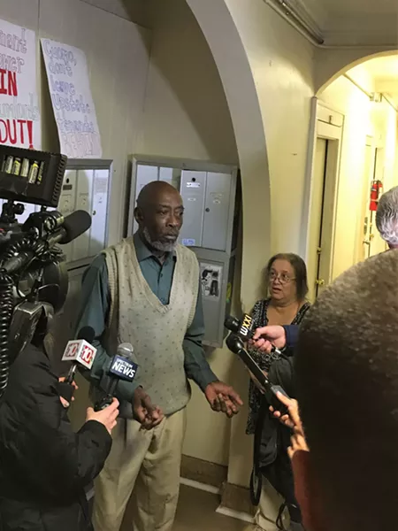 John Lindsey, a tenant of 447 Thurston Road whose bathroom ceiling collapsed several weeks ago and hasn't been repaired, speaks to reporters at a press conference in his building. - PHOTO BY JAKE CLAPP
