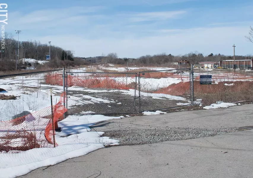Mark IV cleaned up 75 Monroe Avenue, the former Monaco Oil site, to build an apartment complex. But the site has sat idle while approval processes and lawsuits play out. - PHOTO BY JACOB WALSH