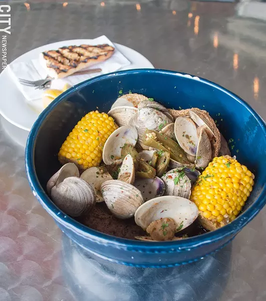 A Seafood Boil Bucket at Jetty at the Port. The restaurant recently made changes to the menu to transition to a casual, beachy feel. - PHOTO BY JACOB WALSH