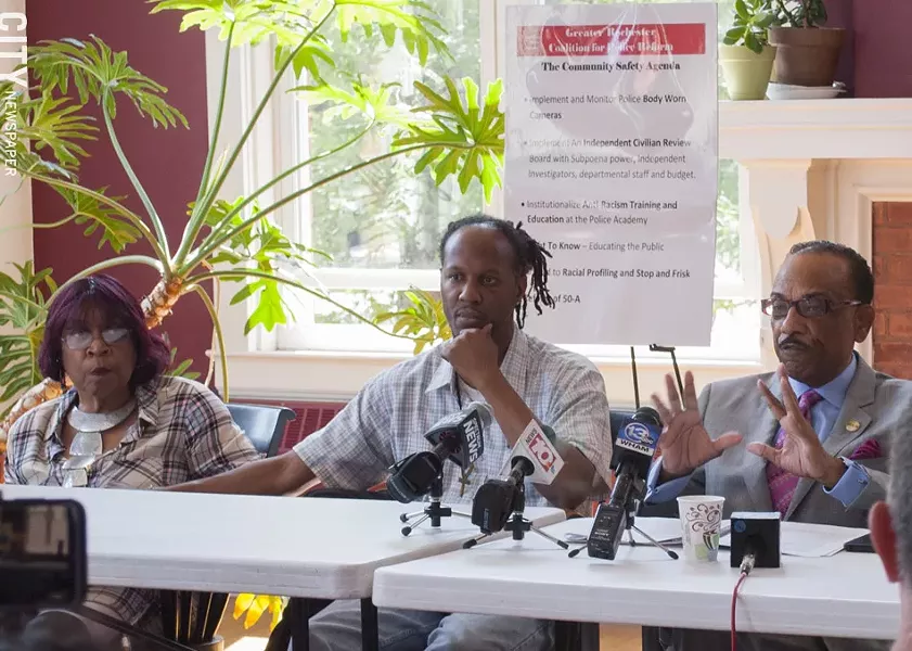 Christopher Pate (center) with his mother and Rev. Lewis Stewart. - PHOTO BY RENEE HEININGER