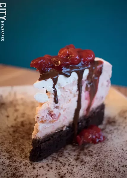Caramel Bakery and Bar's Forbidden Forest layers chocolate cake with cherry cheesecake. - PHOTO BY RENÉE HEININGER