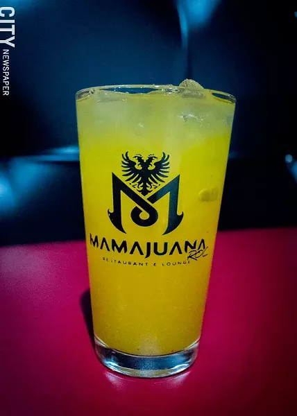 Fresh mango juice from MamaJuana's juice bar. - PHOTO BY RYAN WILLIAMSON
