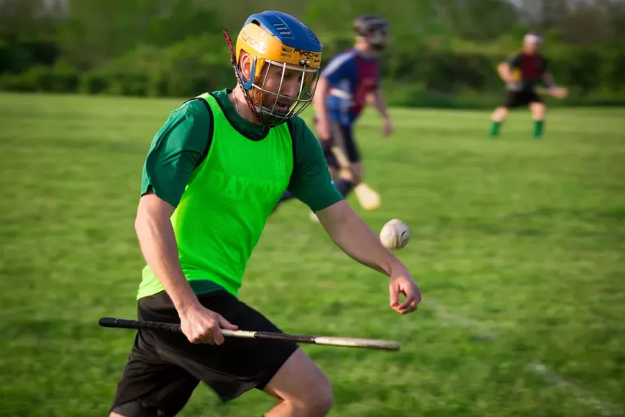 Hurling's equipment: a stick resembling an inefficient canoe paddle and a leather-wrapped cork ball. - PHOTO BY DAVE DEVER AT REVELPIX.COM