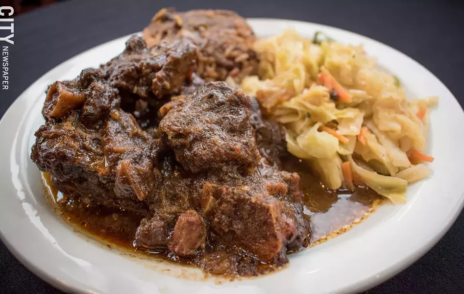 Oxtail, a Jamaican staple, is on the menu at Caribbean Heritage Restaurant. - PHOTO BY JACOB WALSH