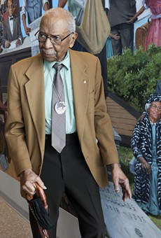 David Anderson, a professor and noted Frederick Douglass scholar, at the unveiling of the Douglass mural in the county airport. Anderson is included in the mural — Michelle Daniels, who commissioned the painting,  said Anderson was invaluable in its development.