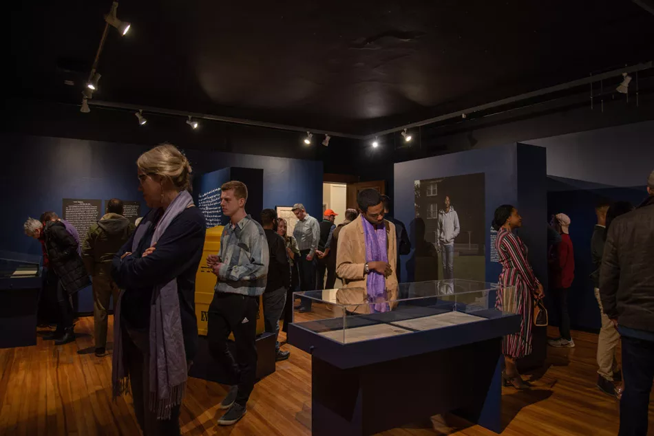 A scene from the opening reception for Joshua Rashaad McFadden's "Evidence" at Visual Studies Workshop. - PHOTO BY SARI OISTER