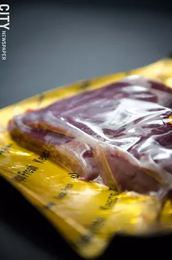 Vacuum-sealed packages help extend the shelf life of meat cuts. - PHOTO BY MARK CHAMBERLIN