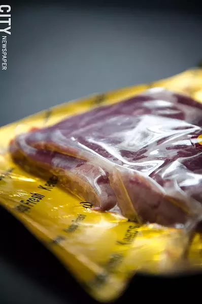 Vacuum-sealed packages help extend the shelf life of meat cuts. - PHOTO BY MARK CHAMBERLIN