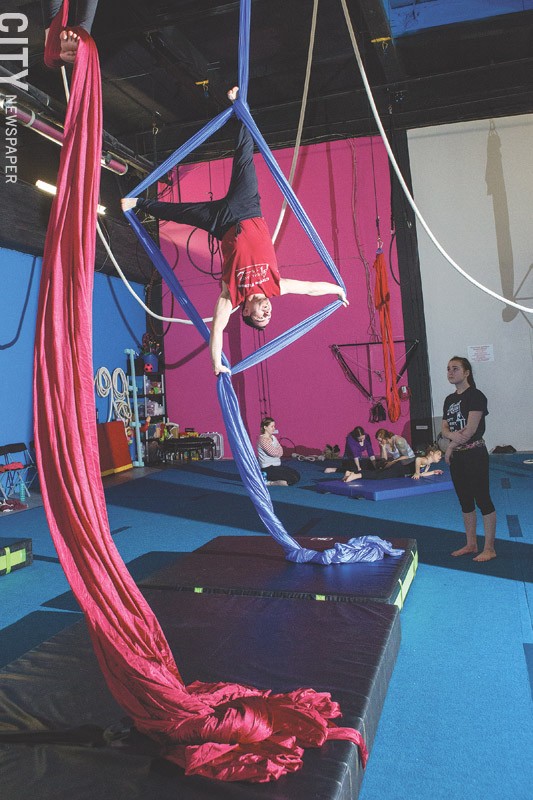William D'Ovidio (pictured) leads the Aerial Silks course at Aerial Arts of Rochester, a business he operates with his wife, Jennifer. - PHOTO BY JOHN SCHLIA