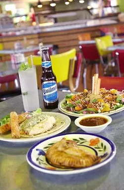 Clockwise from front: Banana with leche quemada and pecan dessert empanada; grilled fish taco with cilantro cole slaw and Betos' poblano sauce; jicama salad with pico de limÛn y naranja, jicama, mandarin oranges, and mixed greens in a lime vinaigrette, topped with coconut; Betos' Cesar Chavez salsa.