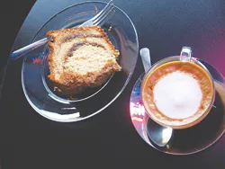 Coffee cake and a macchiato keep each other company at Jupiter.