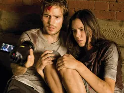 Don’t fear the shaky-cam: Michael Stahl-David and Odette Yustman huddle up.