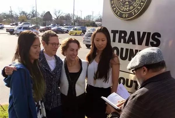 Sarah Goodfriend and Suzanne Bryant, shown here with their daughters Dawn and Ting, became the first same-sex couple to be legally wed in the Sate of Texas on Thursday. - TWITTER
