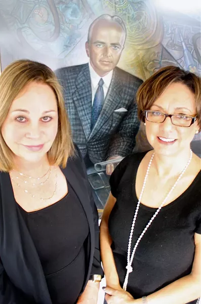 Mind Science Foundation Interim President Catherine Nixon Cooke and Executive Director Meriam Good before a portrait of 'Mystery Hunter' Tom Slick. - GREG HARMAN