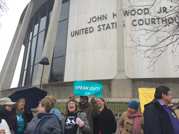 Members of the the Texas Organizing Project, Service Employees International Union of Texas, and Domesticas Unidas gathered at the John H. Wood Federal Courthouse Building on January 14, 2015, to oppose Governor-elect Greg Abbott lawsuit against President Barack Obama's executive action on immigration. - ALEXA GARCIA-DITTA