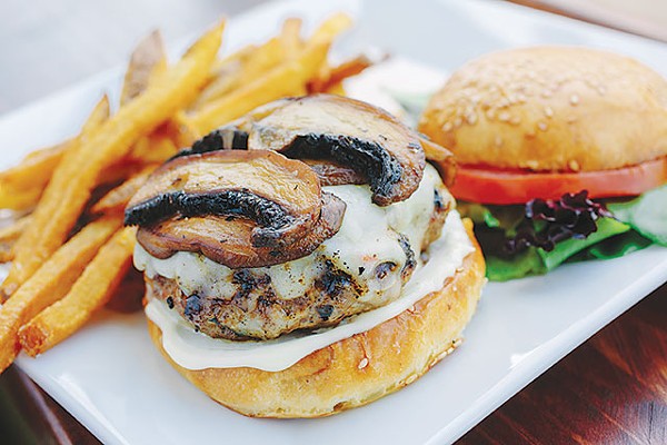 The house burger with pepper jack cheese and grilled ’shrooms - JOSH HUSKIN